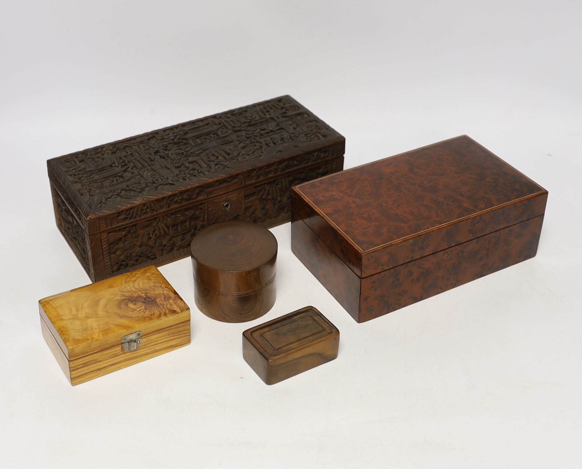 A 19th century Chinese carved boxwood box, an amboyna cigarette box and three others